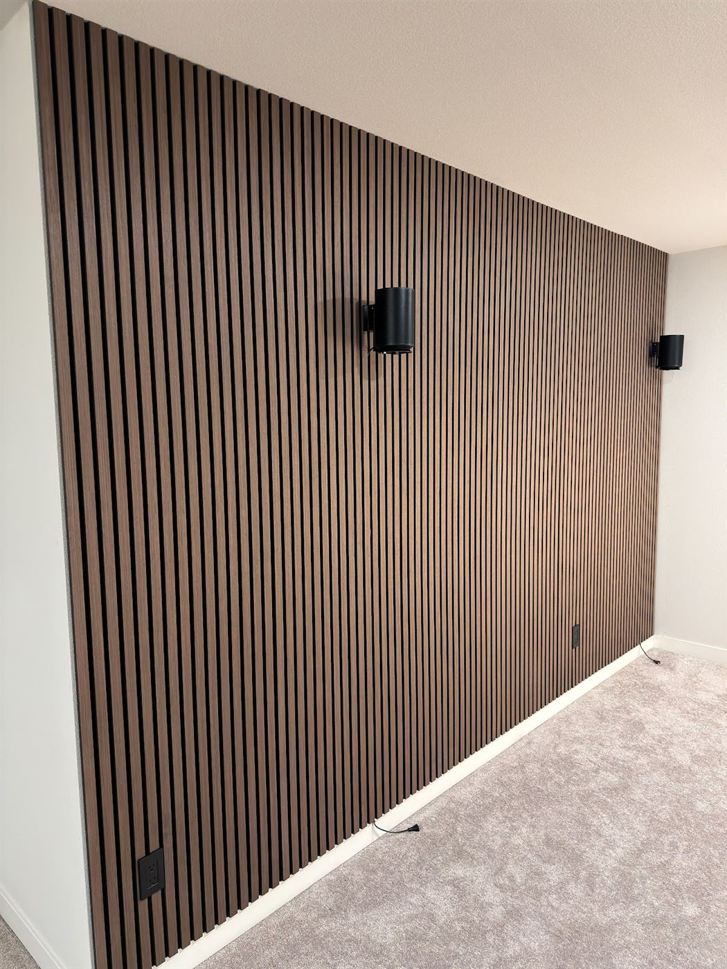 Wood slat accent wall with speakers
